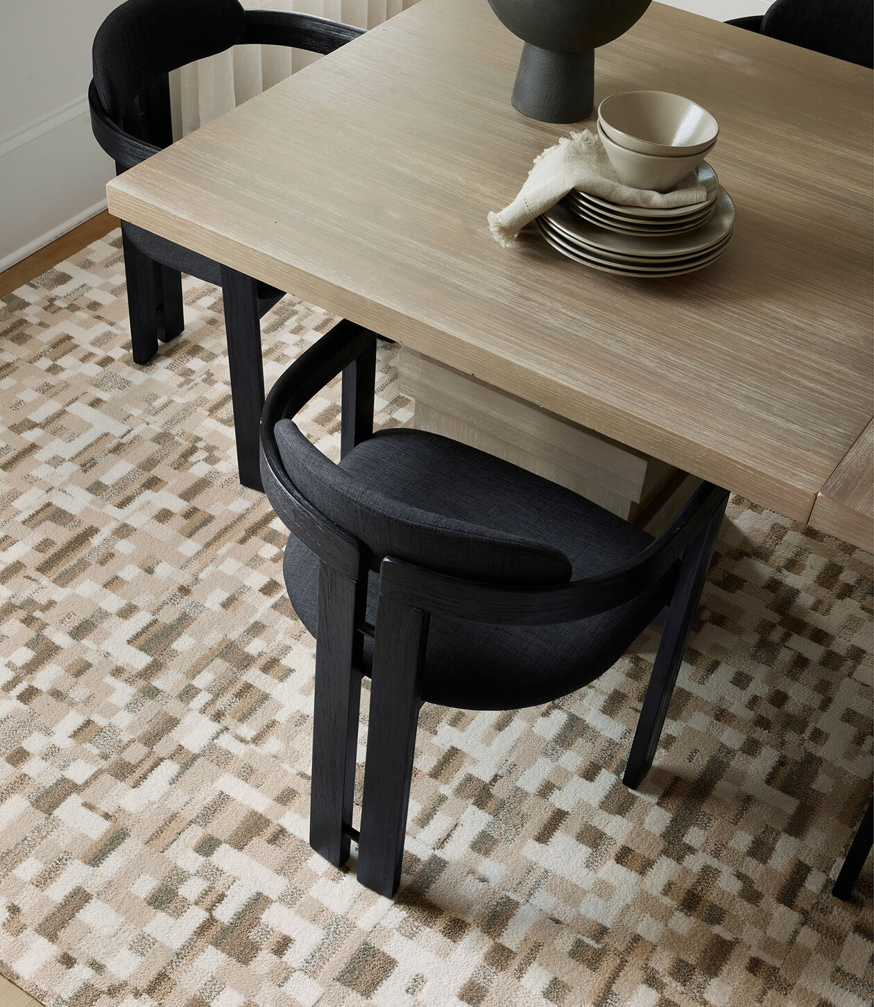 Dining area with FLOR Lost In Pixels area rug shown in Bright White/Bone